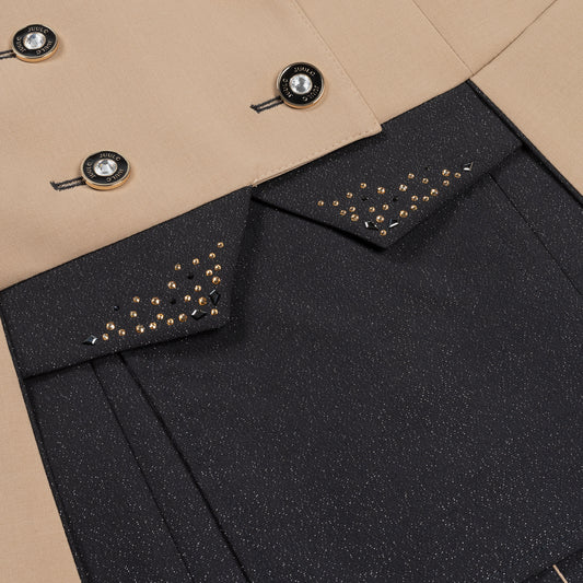 Detail of the black glitter fabric on the inserts and inside the skirt of JuulC Women's Dressage Frack in Sand Sunset