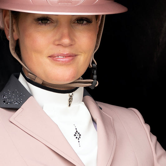 Close-up of model wearing JuulC' Powder Pink Women's Show Coat with Swarovski design on the collar